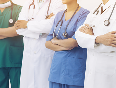 two doctors and two nurses standing together